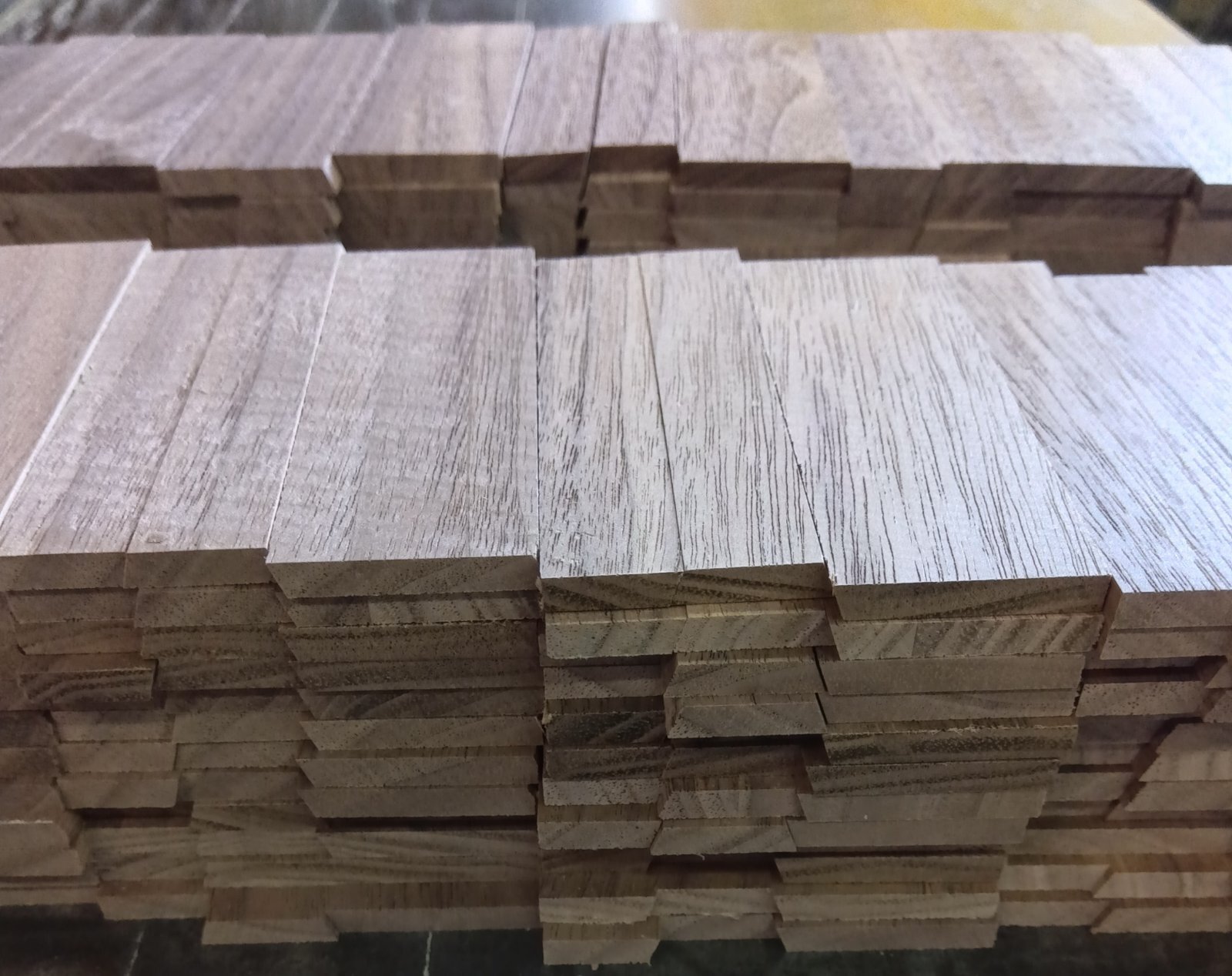 A sliding key made from walnut wood